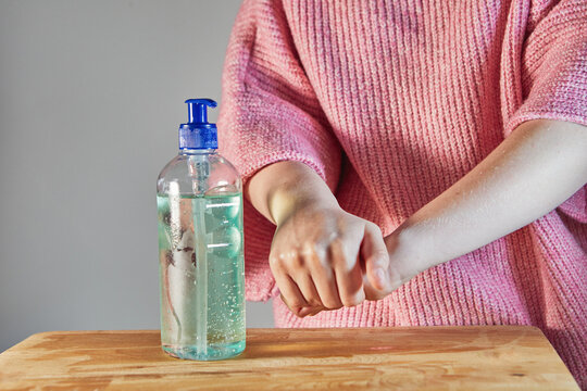 Cleansing hands with hand sanitizer gel with alcohol 70 percent push bottle for hand rubs Protect against viruses and bacteria Concept. Covid-19 or Coronavirus.