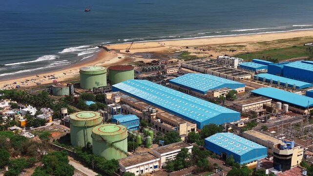 Coastal desalination plant with tanks beside the shore