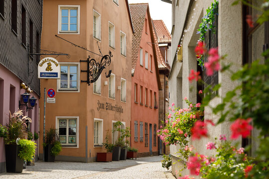 F&uuml;rth, Bavaria, Germany - August 17, 2026: Narrow cozy cobblestone street with aged colorful medieval houses
