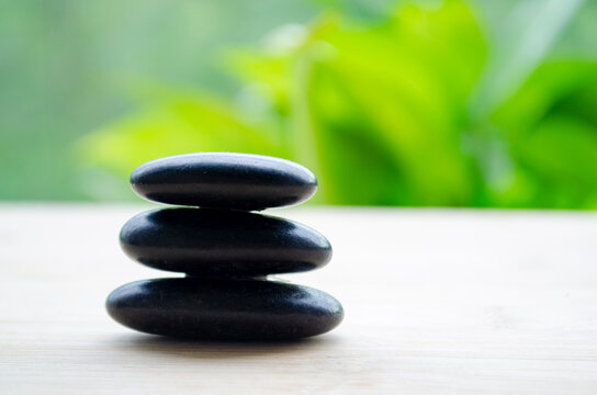 Zen stones symbolizing enlightenment and positive energy, with customizable space for text.