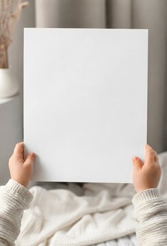 A Baby Holding Blank White Poster Mockup