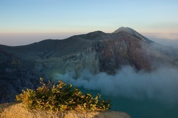 Ijen Volcano Crater with Turquoise Lake and Volcanic Steam © Paul