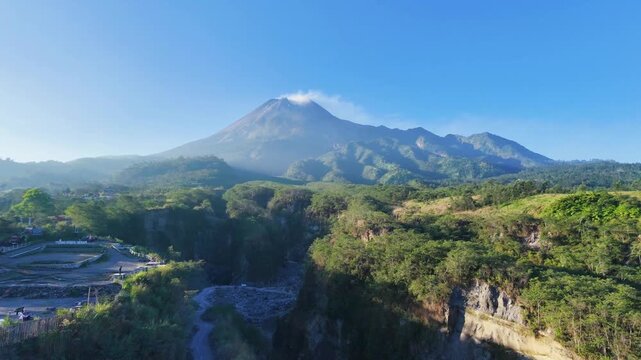 Aerial drone zoom to merapi volcano landscape for travel documentary