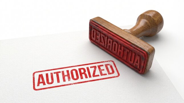 Wooden rubber stamp with the word Authorized in red ink on white background.