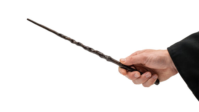 Human hand holding a dark brown twisted wooden magic wand against a plain white background, isolated on a, transparent background