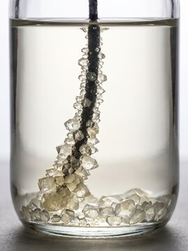 Sugar crystals growing along a seeded string in a supersaturated jar