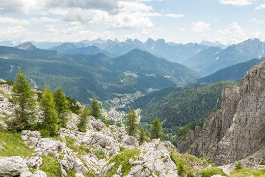 Col dei Baldi, Italy. Panoramic view across the Dolomites and forested mountain valley