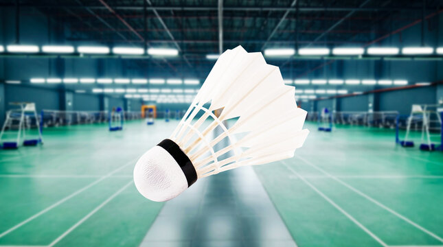 Badminton Racket and Shuttlecock on Indoor Floor, Sports Equipment for Leisure Activity and Game in Empty Parking Garage or Underground Interior Space