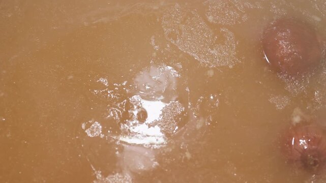 Slow-simmered bone broth in a home kitchen: rich, comforting stock in progress