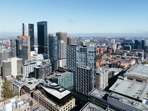 Drone flight in the downtown city skyline, foggy daytime view of Montreal, Quebec, Canada