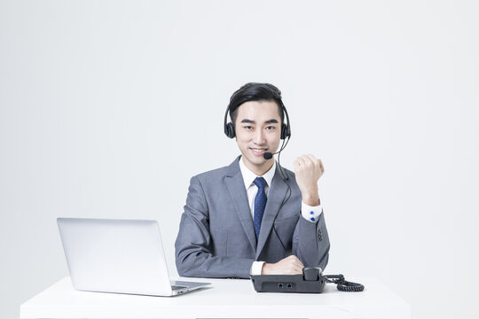 Business customer service representative with headset at desk