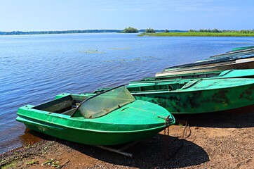 Boats on the sandy bank of the Kama River © Ruslan