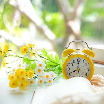 Early Work day.  Alarm clock on bed in morning relax for wellness life with sun light,.  Morning and Start up Concept