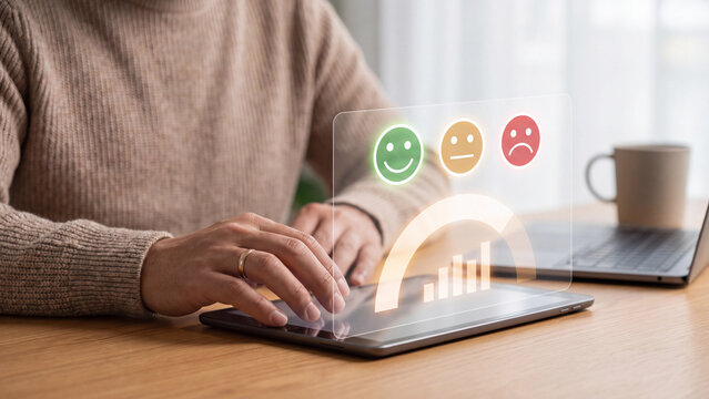 Customer Satisfaction and Feedback Rating Concept, man using tablet with happy, neutral and sad emoji faces and satisfaction gauge for customer experience survey and service quality review