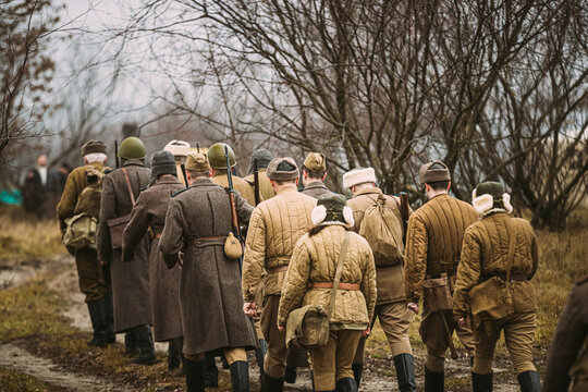 World War II Russian Soviet Red Army Soldiers Marching Through Forest. Soldier Of WWII WW2 Times