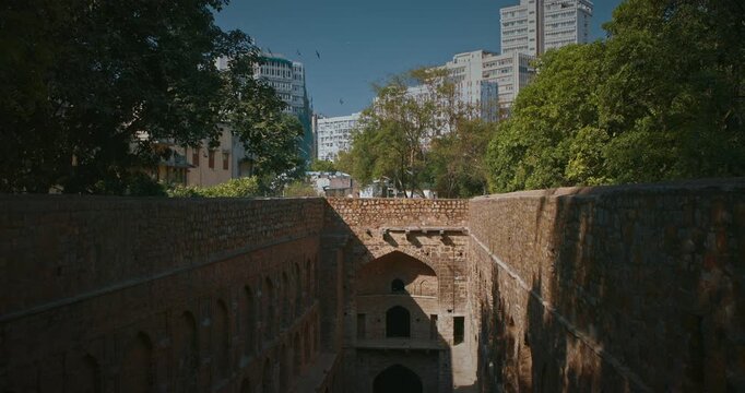 Agrasen Ki Baoli or Ki Baoli in New Delhi. Historic Structure Surrounded by Modern Cityscape