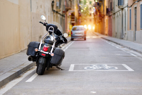 Black Cruiser Motorcycle Parked Narrow European Street Bicycle Lane
