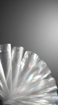 Abstract Transparent Plastic Sheets Fanning Out With Iridescent Light Reflections