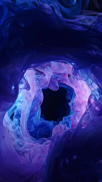 Abstract Blue and Pink Ink Swirls Dissolving in Water on Black Background