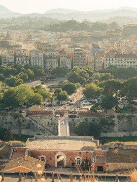 Elevated panoramic view of Corfu Town and the Old Fortress bridge at sunset, Greece