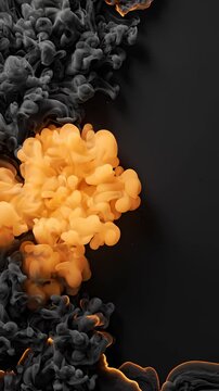 Abstract Motion of Black and Orange Ink Swirling in Water on Black Background