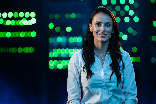 Woman it specialist smiling in data center
