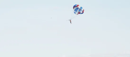 Parasailing over the sea. Da Nang coast. Active leisure. © nadezhda F