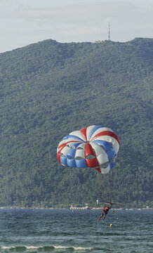 Parasailing over the sea. Da Nang coast. Active leisure.