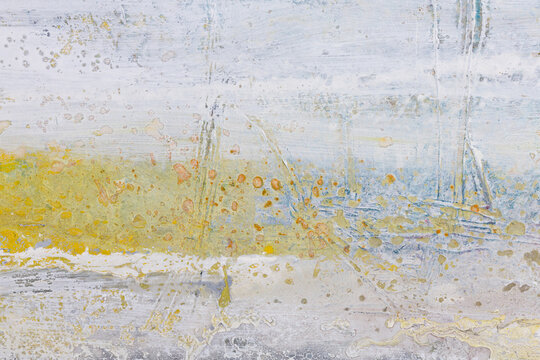 Abstract painted texture in pale grey yellow and blue tones