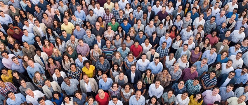 Diverse crowd of people standing together looking up high angle view