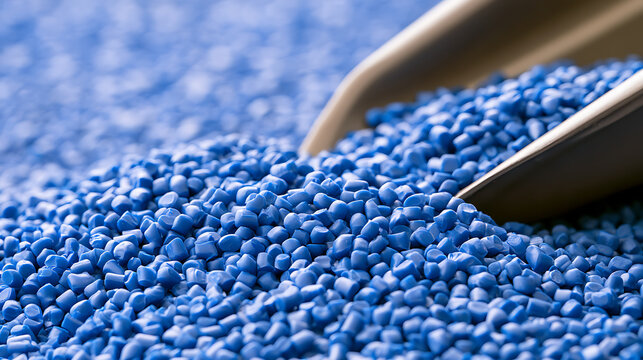 Blue plastic polymer resin pellets raw material for injection molding manufacturing industry factory process production technology stock photo