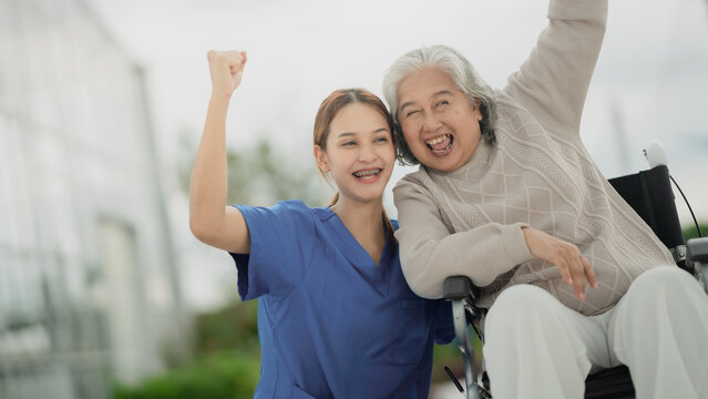 A home health care worker assists an elderly woman in her home / Healthcare aide / Medical assistant