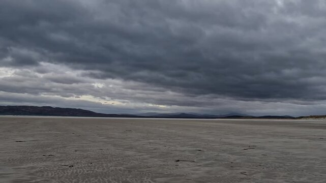 Dramatic clouds at Narin Strand by Portnoo, County Donegal in Ireland.