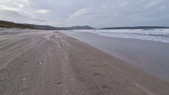 Sandstorm at Narin Strand by Portnoo, County Donegal in Ireland.