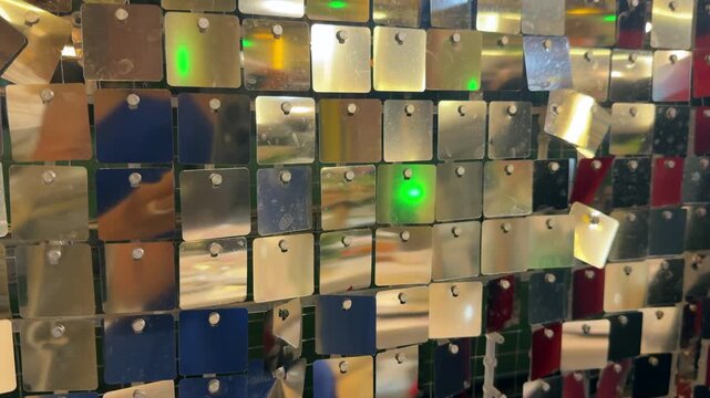 Sparkling glitter reflecting stage lighting. Concept of glamour, celebration, entertainment, luxury and festive atmosphere. . High quality 4k footage
