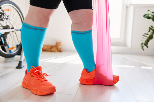 Exercising with resistance band at home training
