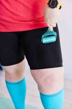 Massaging legs with a roller