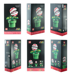 Fototapeta premium Packs set of a Lego construction created in collaboration with Nintendo, featuring a buildable Piranha Plant figure from Super Mario video game, isolated on transparent background