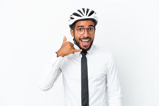 Young business latin man holding a bike helmet isolated on white background making phone gesture. Call me back sign