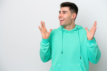 Fototapeta premium Young caucasian man isolated on white background with surprise facial expression