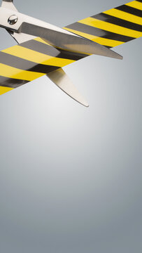 Scissors Cutting Through Yellow and Black Warning Tape