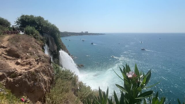 Duden Waterfall and Mediterranean Sea Framed by Coastal Flowers