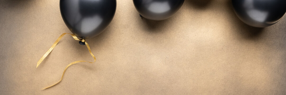 Wide panoramic luxury balloon background with elegant champagne gold copy space for website banners.