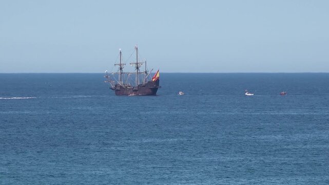 Historic Galleon with Spanish flag sailing close to the coast of Ireland in County Donegal