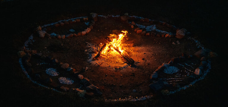 Sacred Fire Pit Decorated with Ceremonial Mandala Ornaments and Stone Circle.