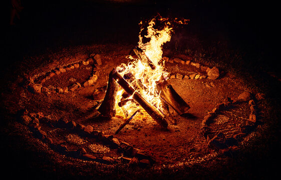 Sacred Fire Pit Decorated with Ceremonial Mandala Ornaments and Stone Circle.