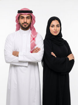 Young Saudi Arabian Couple in Elegant Traditional Clothing Posing Together in Studio