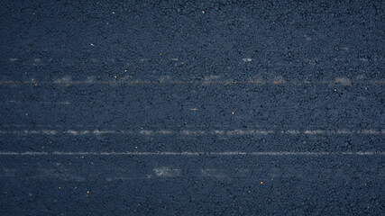 Fototapeta premium Dark blue denim fabric texture. Close up of rugged jeans material with detailed weave pattern.