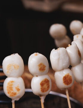 Dango on skewer, Mitarashi dango, traditional Japanese street food, grilled rice cake balls dumplings on wooden sticks, street food festival, Tokyo, Japan, market with local vendor stalls cooking