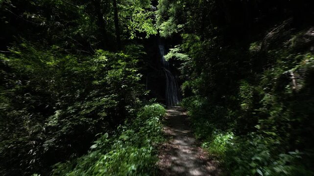 Sunlit Kanjou Falls in Mima, Tokushima, Japan &ndash; Aerial Drone View of a Waterfall Illuminated by Sunlight Filtering Through the Forest
